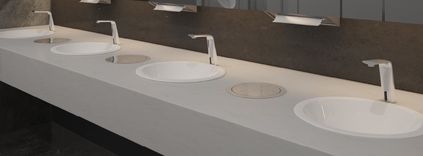Image of Modern public washroom with sleek white sinks, chrome faucets, and recessed drains for hygiene and convenience