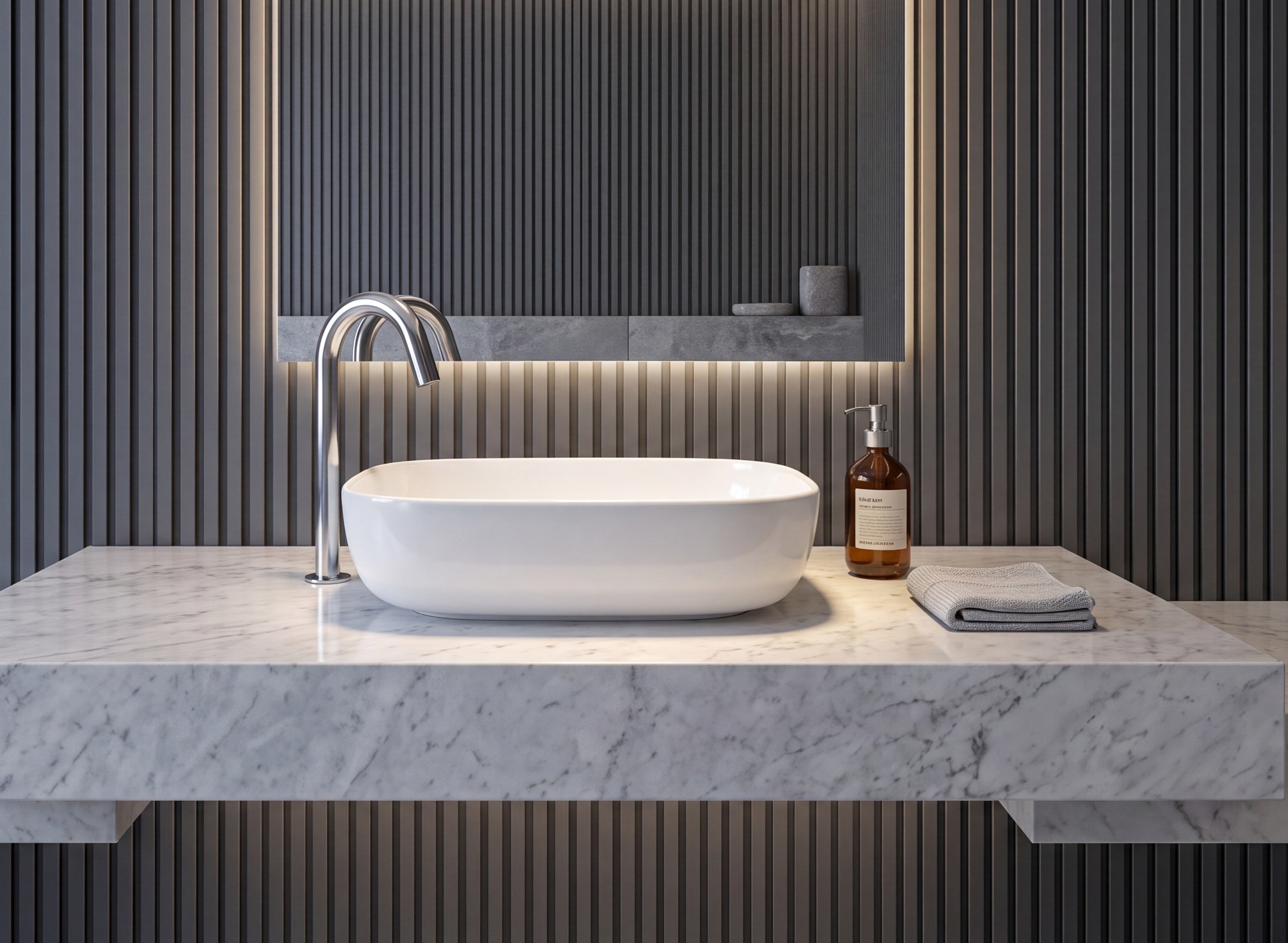 Image of Modern white vessel sink with a chrome faucet on a white marble countertop